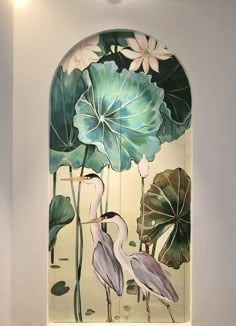 a painting on the side of a wall with flowers and birds