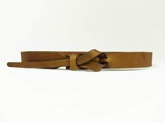 A versatile buckle-less belt, good for looping through your favorite pair of jeans or accessorizing your favorite dress. Handmade with vegetable tanned leather in Peru. ﻿Please note: Belt color may vary slightly due to hide tanning. 1" wide belt. To find your size: Measure your body at the spot you would like to wear the belt (this could be at your natural waist, low on the hips, towards the top of your ribcage, or anywhere in between!); your usual waist measurement may not work if you are plann Adjustable Brown Belt, Adjustable Brown Belt With Self Belt Detail, Everyday Brown Belt Buckles With Belt Included, Casual Brown Adjustable Belt, Casual Adjustable Brown Belts And Suspenders, Hide Tanning, Dress Handmade, Wide Belt, The Spot