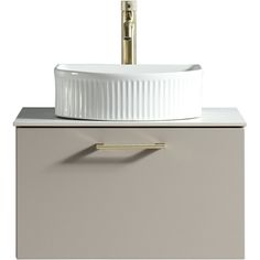 a white sink sitting on top of a gray cabinet next to a faucet