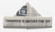 an origami piece with newspaper and clock on it that reads tomorrow is another fine day