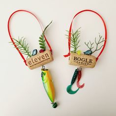 two ornaments with fishing lures hanging from them