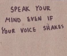 a message written on a piece of cardboard that says speak your mind even if your voice shakes