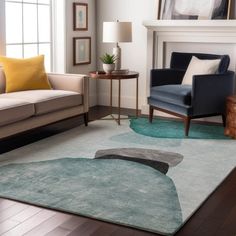 a living room with two couches and a rug on the floor in front of a fireplace