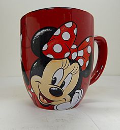 a minnie mouse coffee mug with polka dots on it