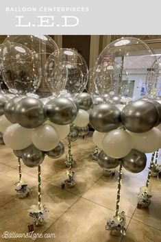 silver and white balloons are on display in the lobby