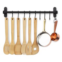 wooden utensils hanging on a black metal bar with magnifying glass and measuring spoons