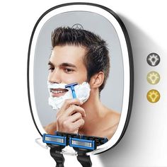 a man shaving his face in front of a mirror with an electric shaver