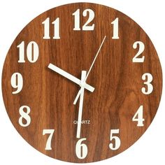 a wooden clock with white numbers on it