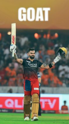 a man holding a cricket bat and ball in his hands while standing on top of a field