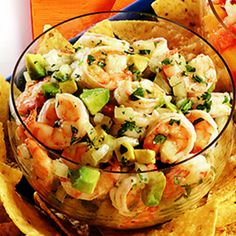 shrimp and guacamole salsa in a glass bowl with tortilla chips