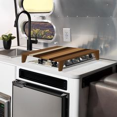 a stove top oven sitting inside of a kitchen