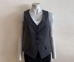 RITVA FALLA Women's Vest Grey Vest Gray Womens Waistcoat Steampunk Formal Fitted Wool Blend Vest Renaissance Baroque Edwardian Victorian  Label size: 38 Measurements (lying flat): Length(back): 21"/ 53 cm Pit to pit: 18"/ 46 cm Waist: 17"/ 43 cm Please check measurements to insure a proper fit. Remember to allow yourself some extra room for movement. You can compare these with something from your closet that fits you well. Condition: Great Vintage Condition Material: 45%wool,55%polyester,2%elast Steampunk Formal, Womens Waistcoat, Grey Vest, Vest Outfits, Women's Vest, Label Sizes, Womens Vest, Favorite Things Gift, Labour Day