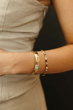 Inscribed with “count your lucky stars” this western-inspired thick gold vermeil cuff bracelet features a turquoise horseshoe and a variety of other good luck talismans to carry with you.    gold vermeil & turquoise    adjustable Count Your Lucky Stars, Mixed Metal Necklace, Winter Jewelry, Out West, Phone Shop, Denim Hat, Metal Necklace, Gold Bracelet Cuff, A Perfect Circle