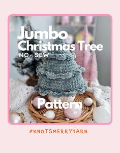 a knitted christmas tree sitting on top of a basket