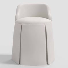 a white chair sitting on top of a white floor