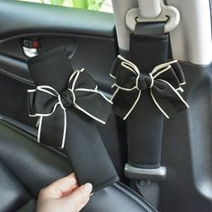 the interior of a car is decorated with black ribbon and bowknots,