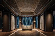 a fancy bathroom with blue curtains and lights