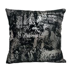 a black and white pillow on a white background