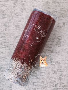 a red glitter tumbler with the word thank written on it and a dog's head