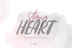 the words strong heart written in red and gray ink on a watercolor stain background