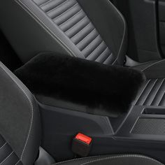 the interior of a car with black leather seats and red trimmings on it