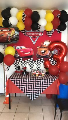 a birthday party with cars decorations and balloons