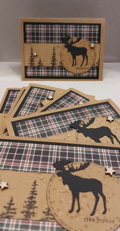 some cards with deer and trees on them