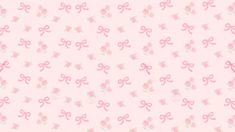 a pink wallpaper with bows and flowers