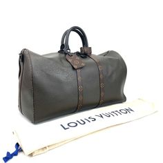 We this is an LOUIS VUITTON Item or 100% of . Limited edition Virgil Abloh 2021 Fall/Winter Collection. Keepall 50 travel duffel bag with bandoulière shoulder strap. Full Taiga leather in elegant deep green-grey khaki color with LV monogram leather accents, dual rolled top handles, single optional flat shoulder strap with shoulder guard, brown canvas lining and two-way zip closures at top. Includes dust cover. Measurements: Shoulder Strap Drop: 20.25", Handle Drop: 4.25", Height: 11.25", Width: 20.25", Depth: 8.75" SKU: KEEPALL50T-LV-11822-1957 Please remember that most of the items that we carry have been previously owned. We the ity of this item or receive . Shoulder Guard, Louis Vuitton Keepall 50, Travel Duffel Bag, Louis Vuitton Limited Edition, Louis Vuitton Keepall, Fall Winter Collection, Lv Monogram, Travel Duffel, Duffel Bag Travel