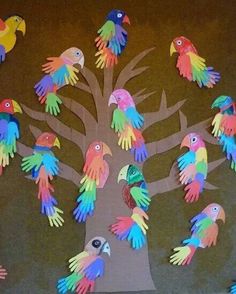 colorful handprinted tree with birds on it