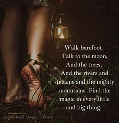 a person standing next to a lantern in the woods with a quote on it that reads walk barefoot talk to the moon, and the trees, and the rivers and streams and streams