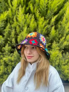 Item Information *Crochet Floral Bucket Hat *You can clean it in wash machine at 30 degrees. *If you have any questions you can contact us. (Customization,size, shipping etc.) Welcome to AlisdaKnit!  We started our journey with my mother we opened a little Instagram page called @alisdaknit for handmade, knitted clothes, crochet clothes; from now on we just started to sell in Etsy. You can find different kinds of designed clothes in our page. Our location is İzmir/ Turkey, but we can ship worldwide. Shipping Information Our page is using express shipping. Delivery Time for Turkey is around 1-3 days, 3-7 days for USA, Canada and 3-7 days for Europe Continent. Shipping is Free Extra Information Contact us for different designs that you desire and if you are seeing an item that out of stock yo Multicolor Wide Brim Mini Hat, Retro Multicolor Hats For Festivals, Retro Multicolor Sun Hat, Multicolor Hand Knitted Crochet Hat For Festival, Multicolor Hand-knitted Crochet Hat For Festivals, Multicolor Wide Brim Crochet Hat For Winter, Multicolor Crochet Brimmed Sun Hat, Winter Multicolor Wide Brim Crochet Hat, Multicolor Brimmed Crochet Sun Hat