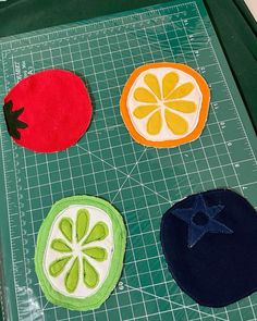 three pieces of fruit are sitting on a cutting board