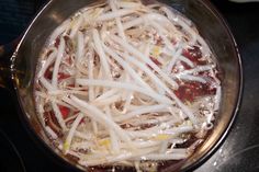 the food is prepared and ready to be cooked in the pot on the stove top