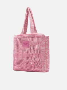 a pink tote bag on a white background