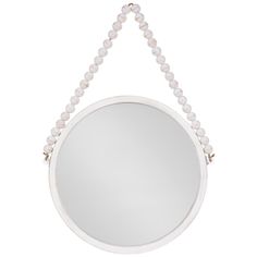 a white round mirror hanging from the side with beaded cord around it's edge