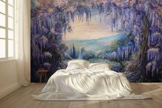 a bedroom with a large painting on the wall