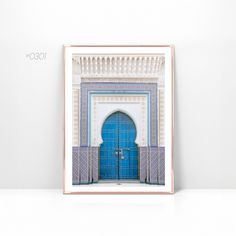 a blue door is in the middle of a white wall with a pink border around it