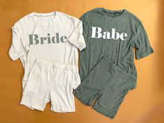 two t - shirts with the words bride and babe printed on them sitting next to each other