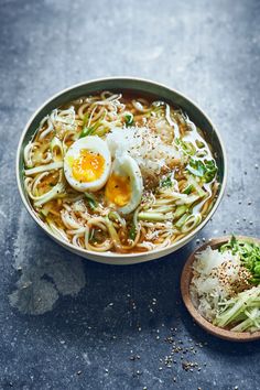 a bowl of ramen with an egg on top