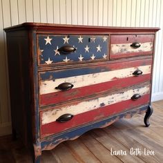 an old american flag painted dresser with black knobs