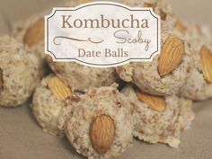 some kind of food with nuts on top and the words kombucha society date balls above it