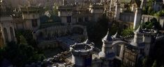 an aerial view of a castle with many towers