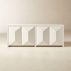 a white cabinet with three doors on the front and one door open to reveal something