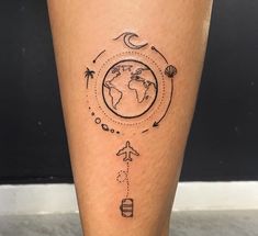 a person with a tattoo on their leg that has an image of the earth and stars