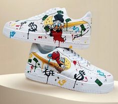 Get your one-of-a-kind, authentic Air Force 1's customized to perfection. Our shop stands out as the premier destination for bespoke sneakers. Why Choose Us? Genuine Air Force 1's: We start with authentic Air Force 1's to ensure the highest quality. Tailored to You: Every pair is made to your exact specifications. Message us with your unique design ideas. Handcrafted Excellence: Our designs are meticulously crafted and painted by hand using specialized leather paint, then sealed with an acrylic New Blance Shoes, Custom Nike Air Force 1, Custom Nike Air Force, Lv Sneakers, Custom Kicks, Unique Sneakers, Air Force 1 Custom, Scrooge Mcduck, Unique Products Design