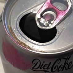 a can of diet coke sitting on top of a table