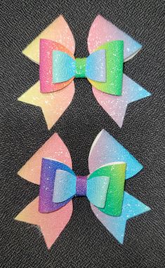 Pair of pastel and bold rainbow faux leather bow. Llamas With Hats, Rainbow Bow, Metal Hair Clips, Leather Bow, Leather Bows, Metallic Hair, Barrette Clip, Barrettes, Hair Clips