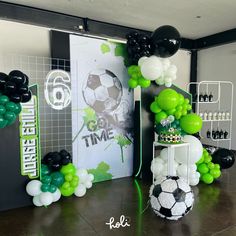 a soccer themed party with balloons and decorations