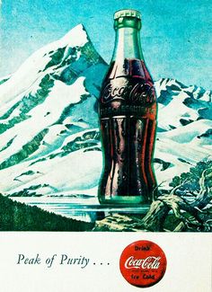 an old coca cola advertisement with a mountain in the back ground and snow capped mountains behind it